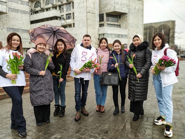 Flowers and congratulations on March 8th from volunteers!